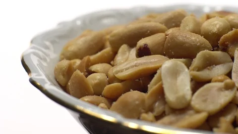 Raw peeled peanuts fried with salt. Rotation. Snack closeup. Stock Footage 102235983