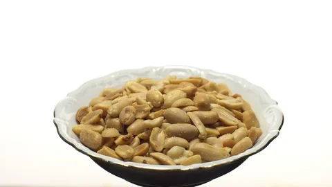 Raw peeled peanuts fried with salt. Rotation. Snack closeup. Stock Footage 102236068