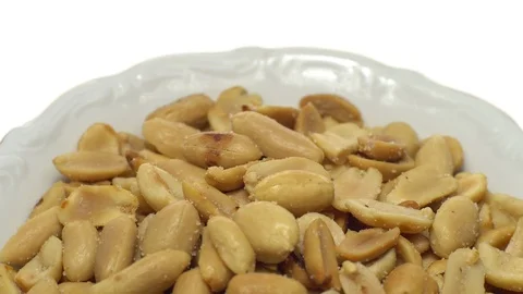 Raw peeled peanuts fried with salt. Rotation. Snack closeup. Stock Footage 102236319