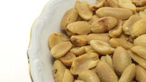Raw peeled peanuts fried with salt. Rotation. Snack closeup. Stock Footage 102236360