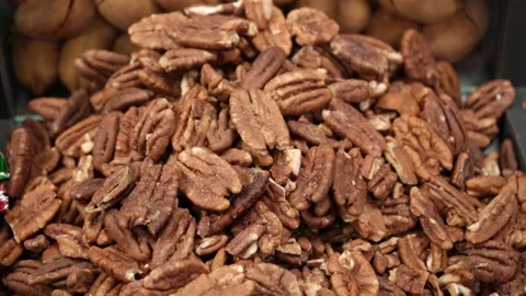 Raw peeled pecan kernels on the store counter. Stock Footage 232716132