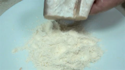 Raw piece of fish roll in flour in slow motion the hands. Stock Footage 134732522