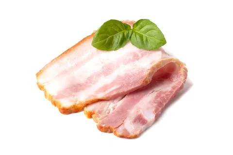 Raw piece of fresh bacon with basil leaf green isolated on a white background Stock Photos