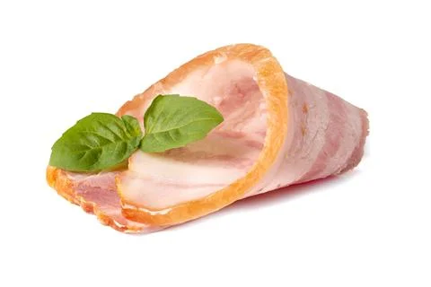 Raw piece of fresh bacon with basil leaf green isolated on a white background Stock Photos