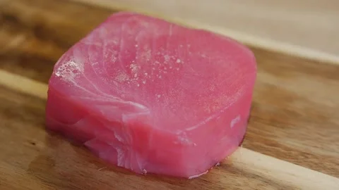 Raw piece of tuna salt Stock Footage 131367704