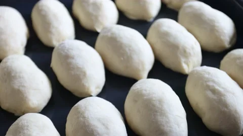 Raw pies with filling on a backing sheet. Motion of the camera. Stock Footage 180595847
