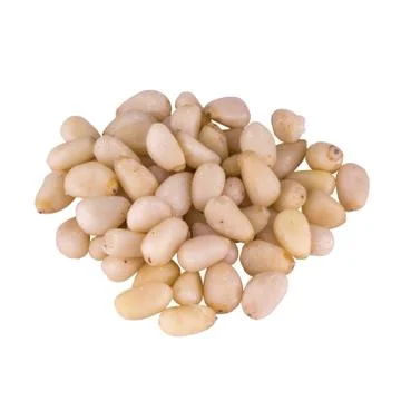 Raw pine nuts stacked in a pile and isolated on white background Foto stock