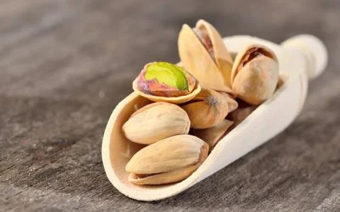 Raw pistachio nuts Stock Photos