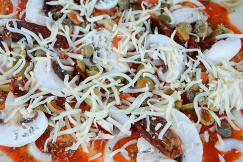 Raw pizza before baking - close up Stock Photos