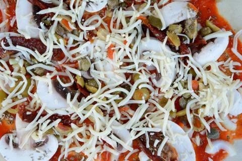 Raw pizza before baking - close up Stock Photos
