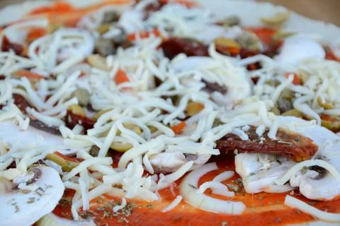 Raw pizza before baking - close up Stock Photos