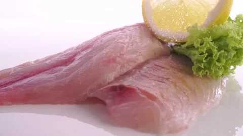 Raw Pollack Fish Fillet turn around on white Background Stock Footage 218253430