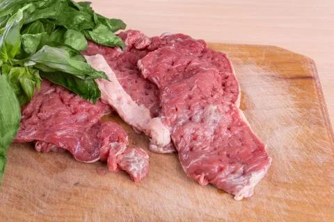 Raw pork and basil Stock Photos