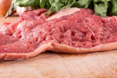 Raw pork and basil Stock Photos