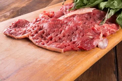 Raw pork and basil Stock Photos