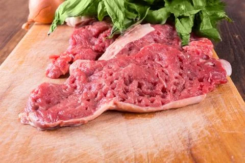 Raw pork and basil Stock Photos