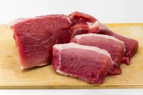 Raw pork on the Board on a white background Stock Photos