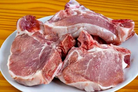 Raw pork chops Stock Photos