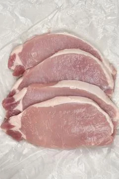 Raw pork chops Stock Photos
