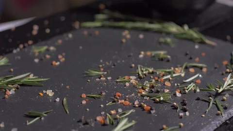 Raw pork chops with spices fall over each other Stock Footage 106473229