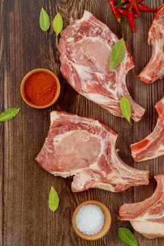 Raw pork chops with spices to make delicious dish. Stock Photos