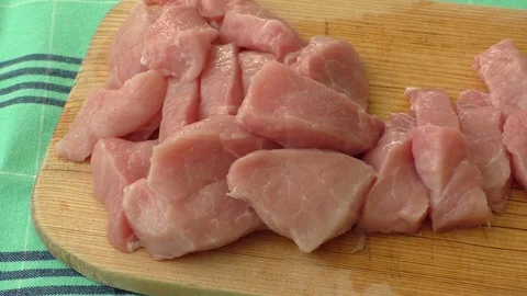 Raw pork on cutting board. Preparing meats for grilling Video stock 76016783