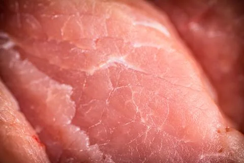 Raw pork. Macro background. The texture of the meat. Stock Photos