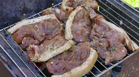 Raw Pork Meat Steak on Barbecue Grill Stock Footage