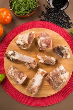 Raw pork rib on wooden background Stock Photos