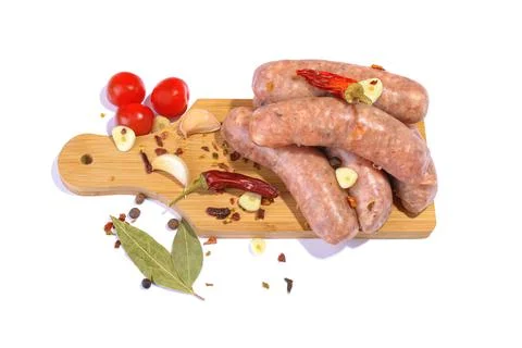 Raw pork sausages.Grilled sausages in close-up, isolated on a white backgroun Stock Photos