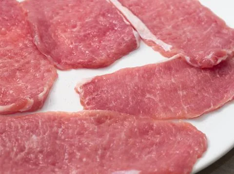 Raw Pork Slices Stock Photos