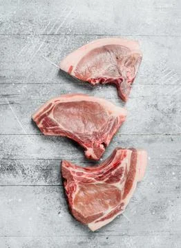 Raw pork steaks on the bone. Stock Photos