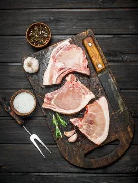 Raw pork steaks on the bone. Stock Photos