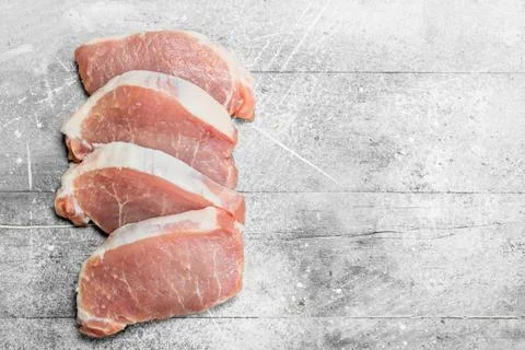Raw pork steaks. Stock Photos