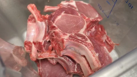 Raw porkchop in container ready to be marinated Video stock 89383813
