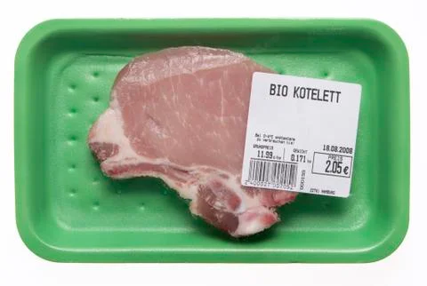 Raw porkchop in styrofoam box, elevated view Stock-Fotos