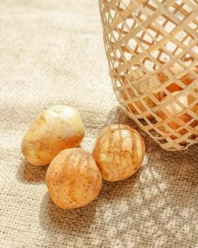 Raw of Potato with bright background Stock Photos