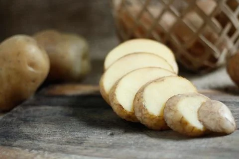 Raw of Potato with bright background Stock Photos