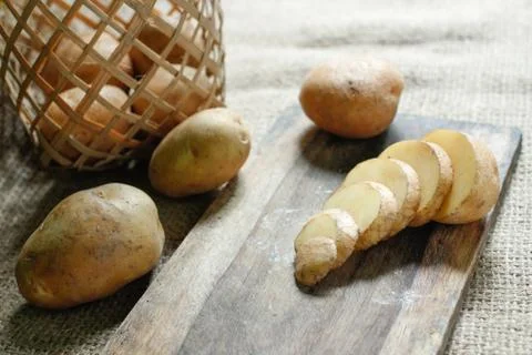 Raw of Potato with bright background Stock Photos