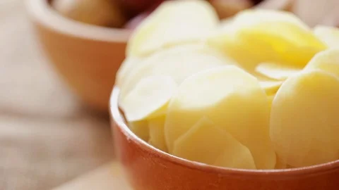 Raw potato chips rotating, steadicam close-up Stock Footage 91110725