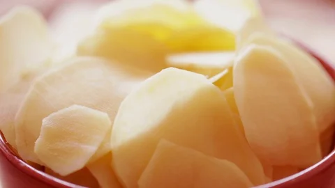 Raw potato chips rotating, steadicam close-up Stock Footage 91111253