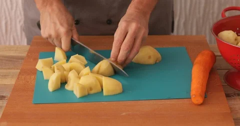 Raw potato chopping, close-up Stock Footage 102082322