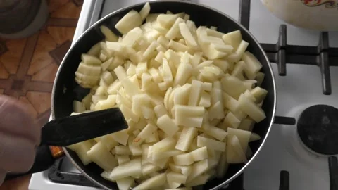 Raw potatoes are fried in a pan Video stock 164278603