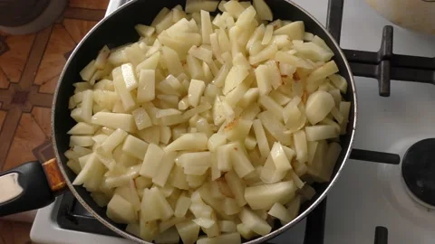 Raw potatoes are fried in a pan Stock Footage 164278639