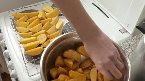 Raw potatoes mixed with spices Stock Footage 142283173