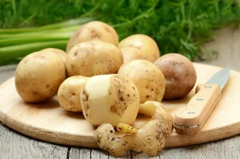 Raw potatoes Stock Photos