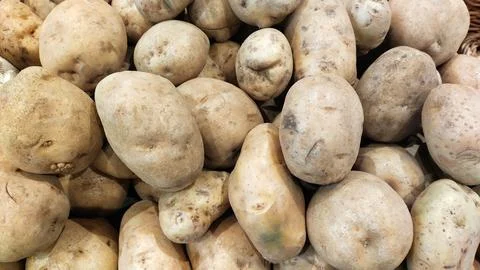 Raw potatoes Stock Photos