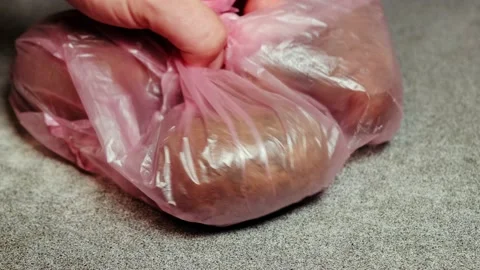 Raw potatoes in a plastic bag on the kitchen table. Stock Footage 164782483