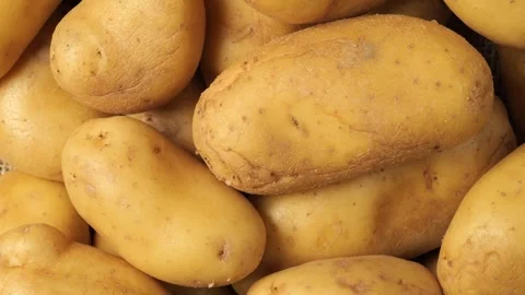 Raw potatoes slowly rotating Stock Footage 342437841