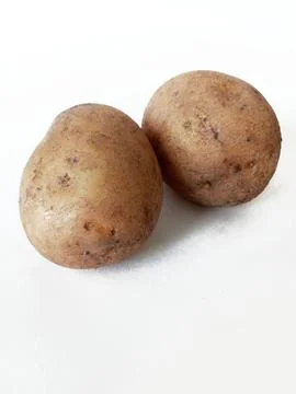 Raw potatoes on white background Stock Photos